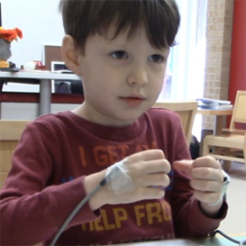 Boy with sensors on his hands